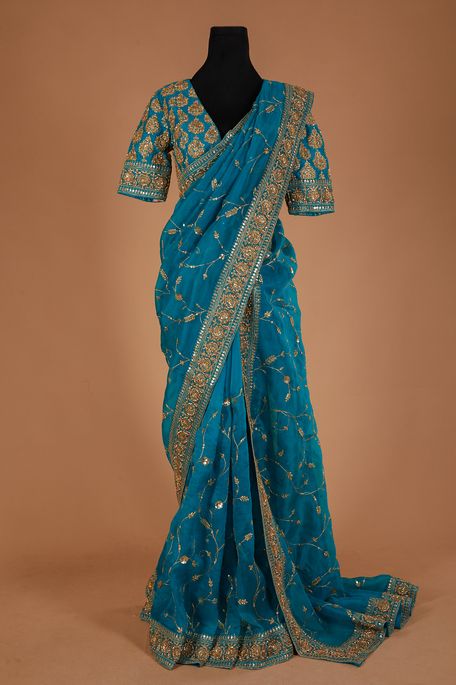 organza jungle sea green saree with stitched blouse