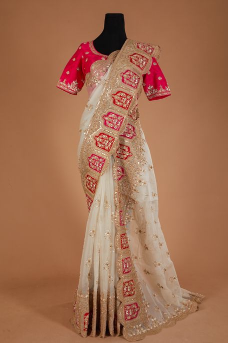 organza light beige saree with stitched blouse
