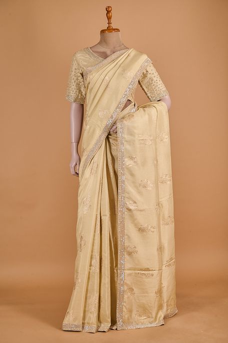 dupion dark cream saree with stitched blouse